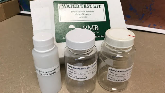 Well testing kit with a box and three bottles