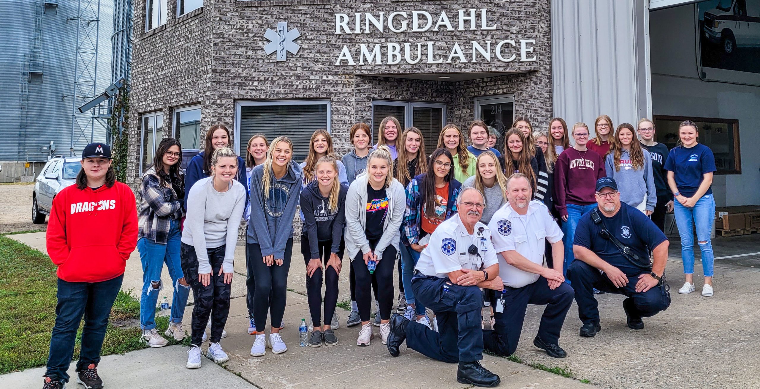Photo of students on a field trip to Ringdahl Ambulance with workers